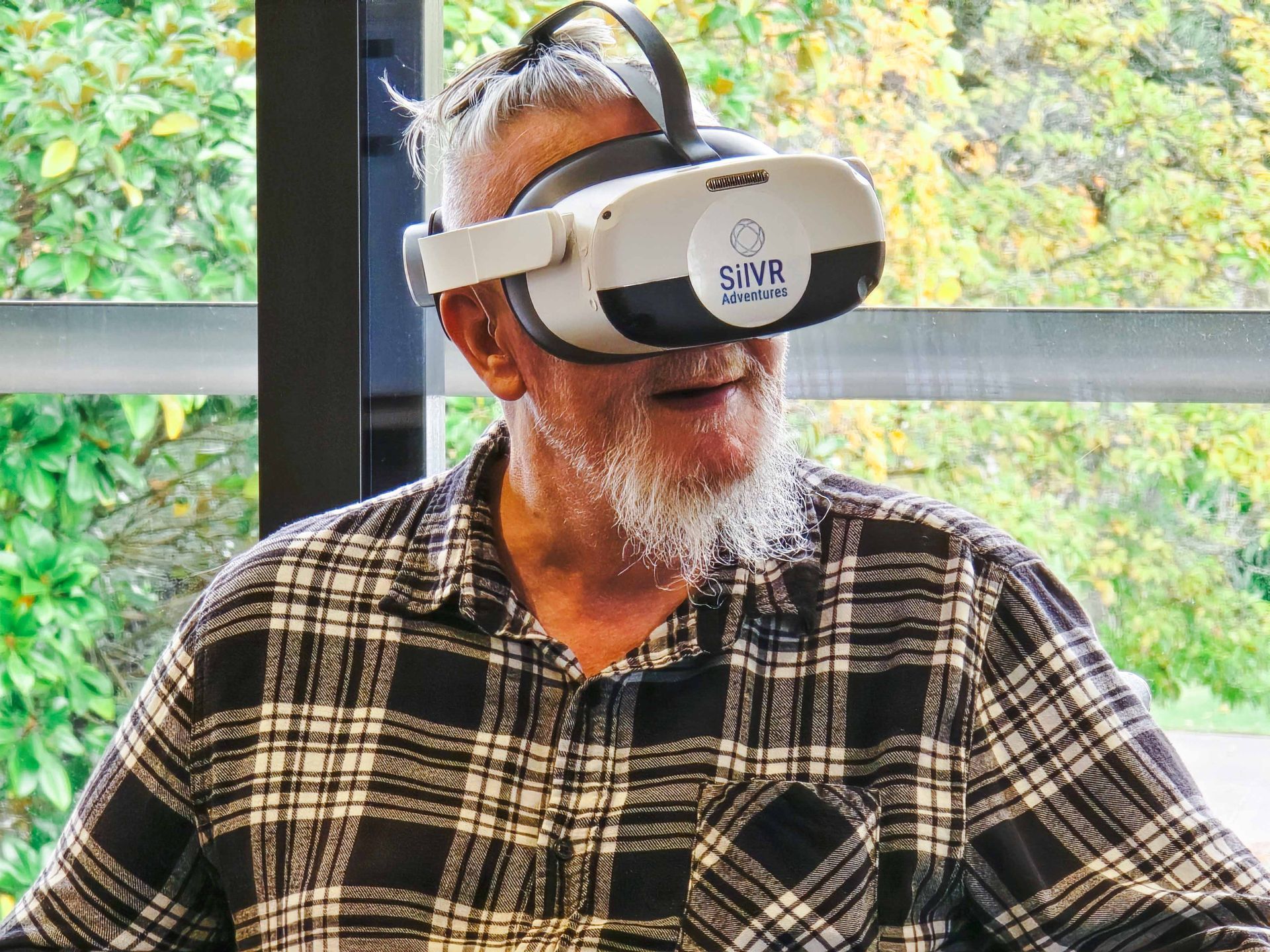 A Care Home resident wearing a VR Headset