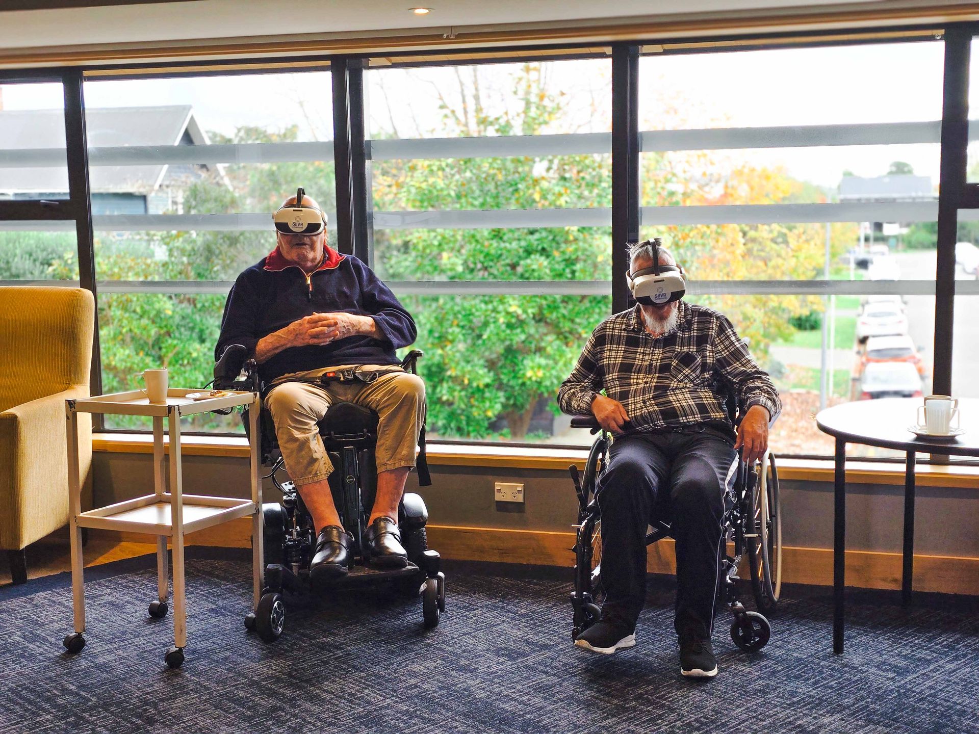 Care Home residents wearing VR Headsets