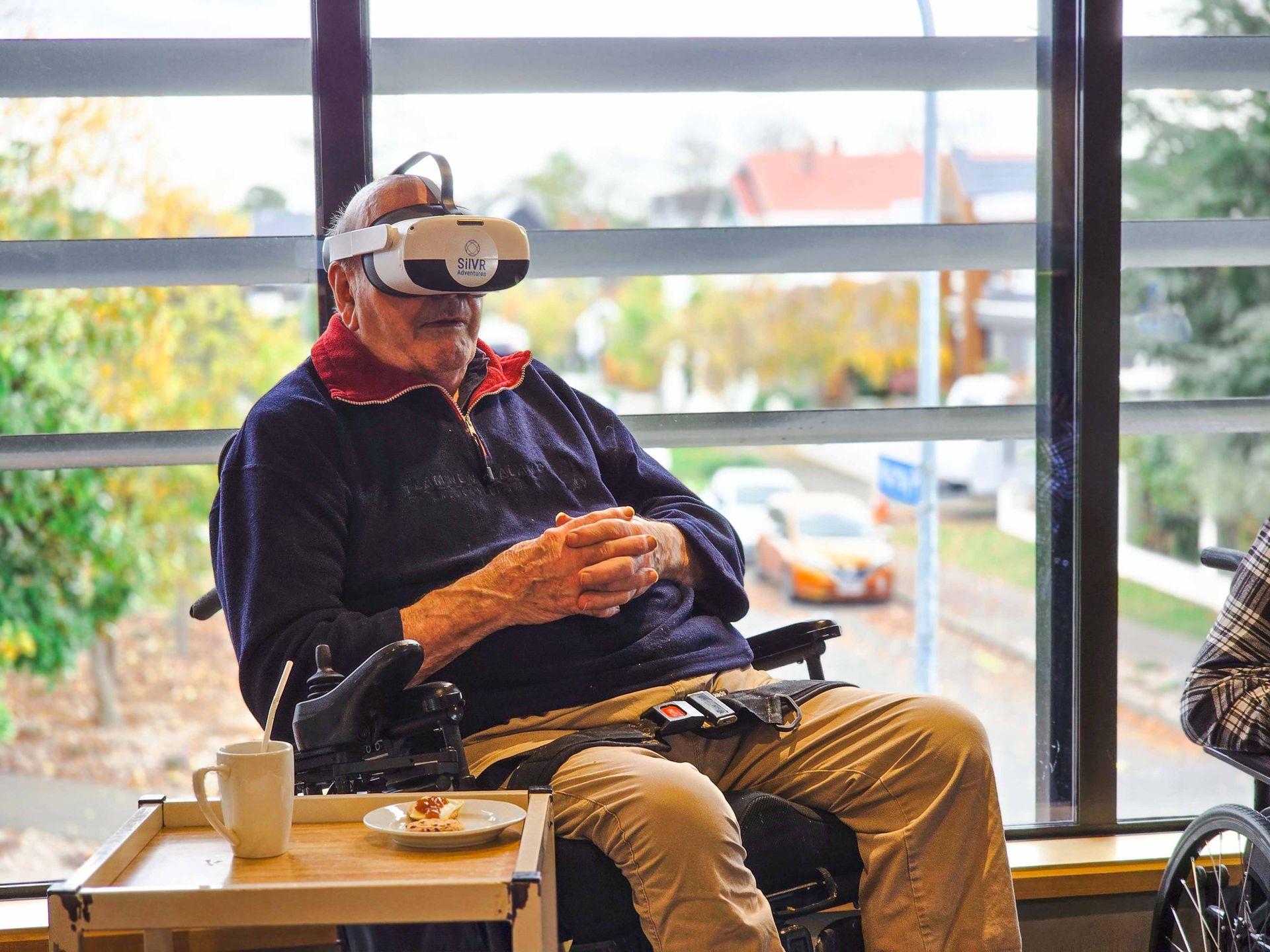 A Care Home resident wearing a VR Headset