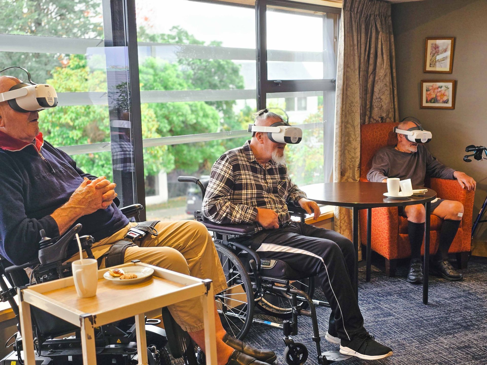 Care Home residents wearing VR Headsets