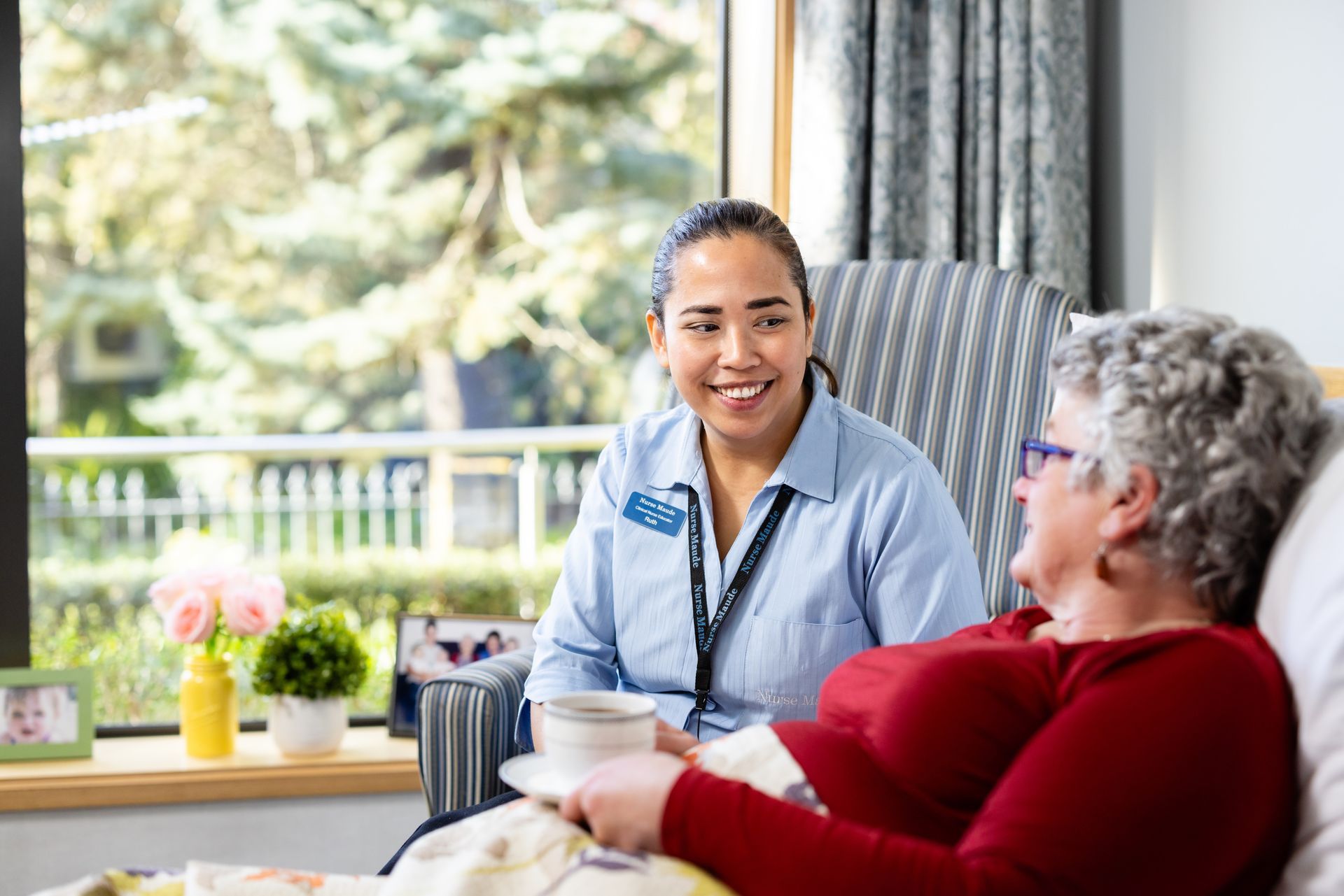 Nurse sitting with a Care Home resident