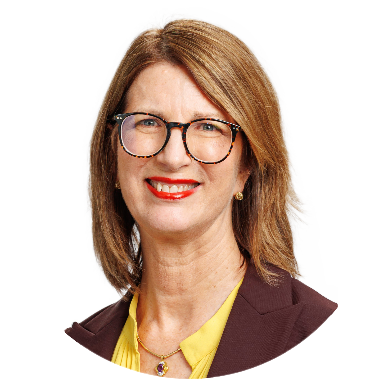 A man in a suit and tie is smiling for the camera. Jim Magee