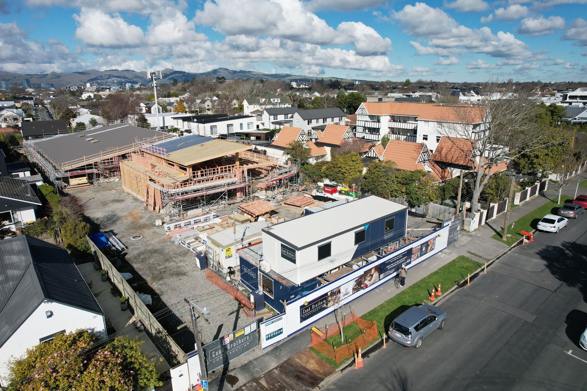 A building site with a crane in a semi residential area
