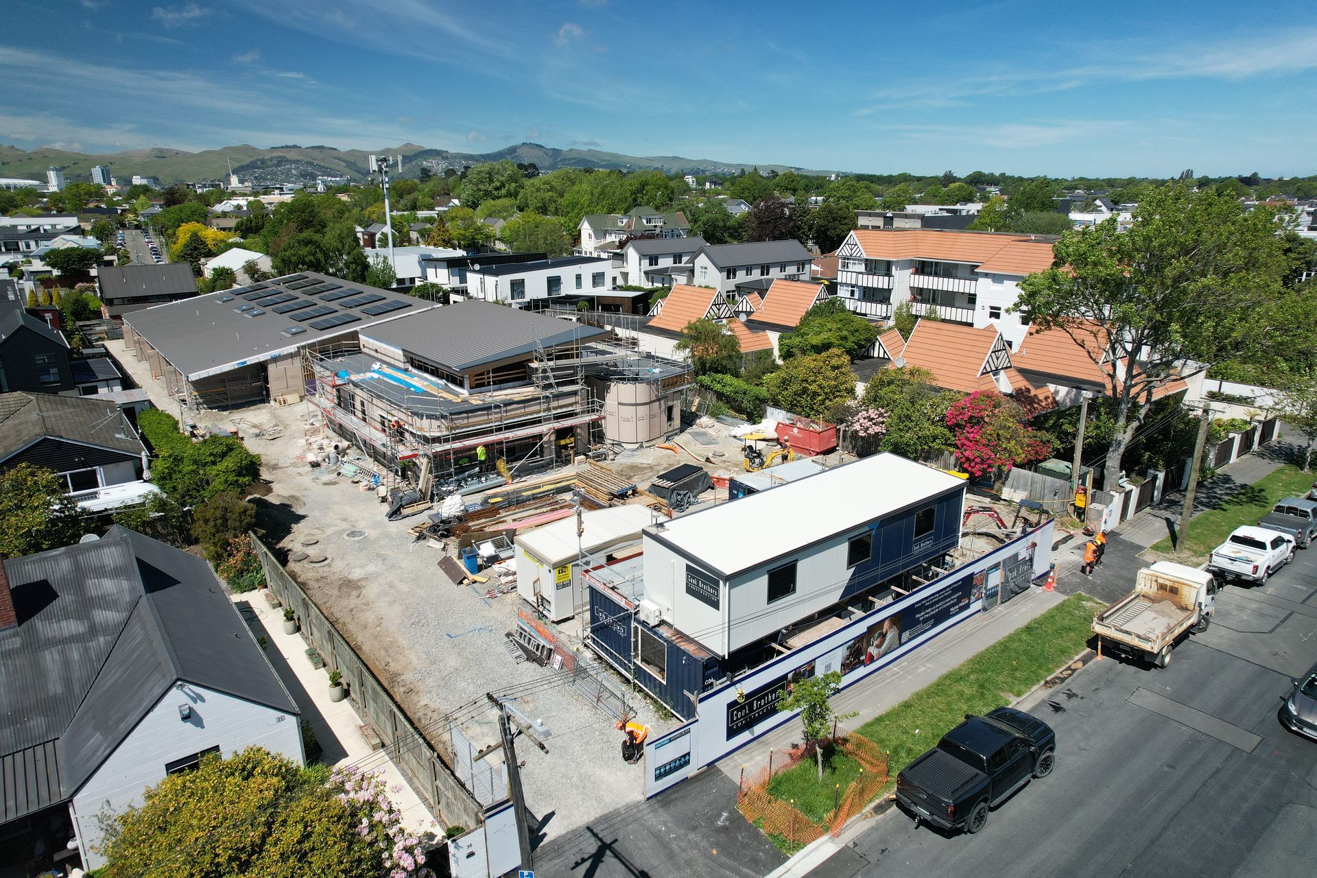A building site with a crane in a semi residential area