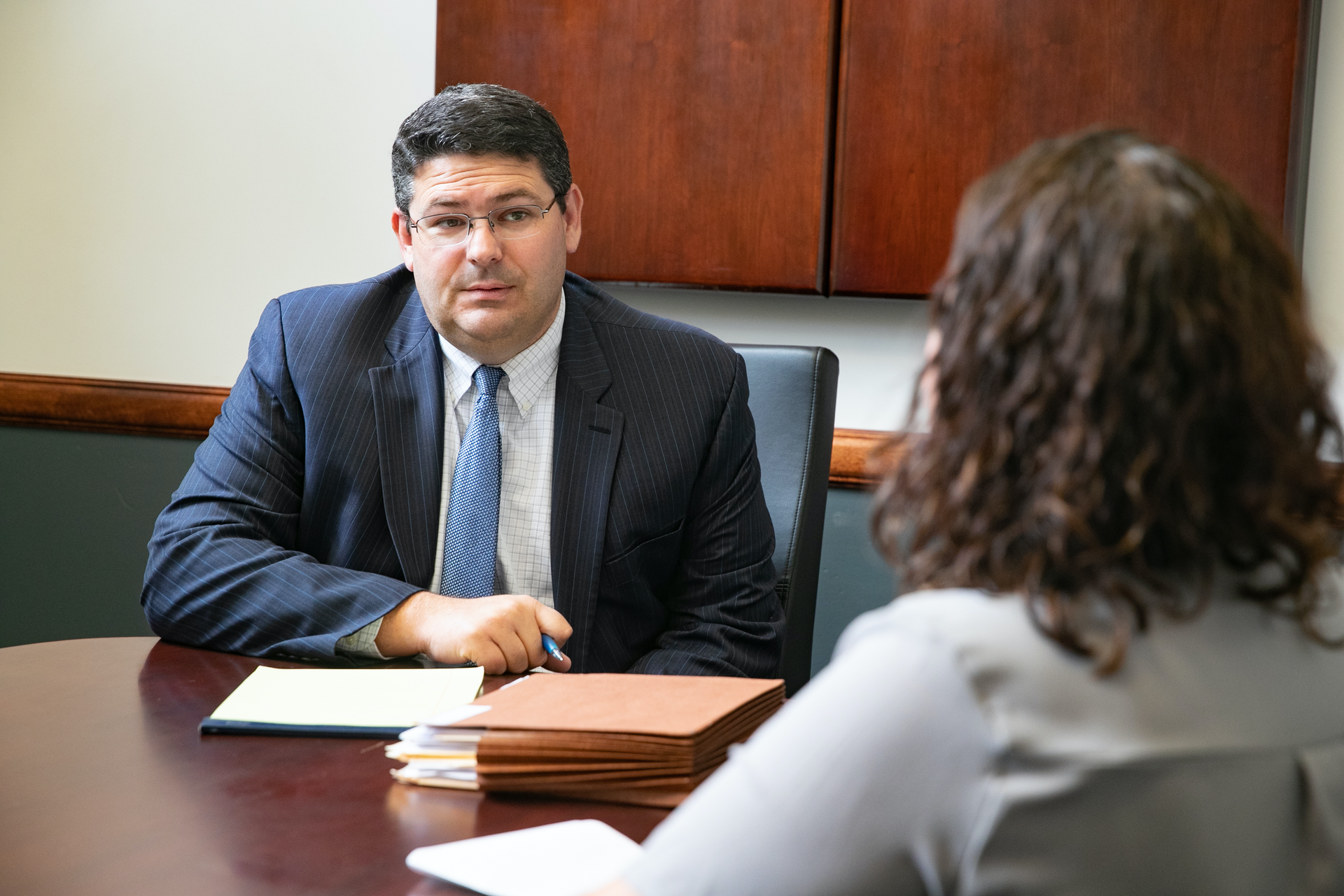 Attorney, Jeff Goodnight, speaking with a client.