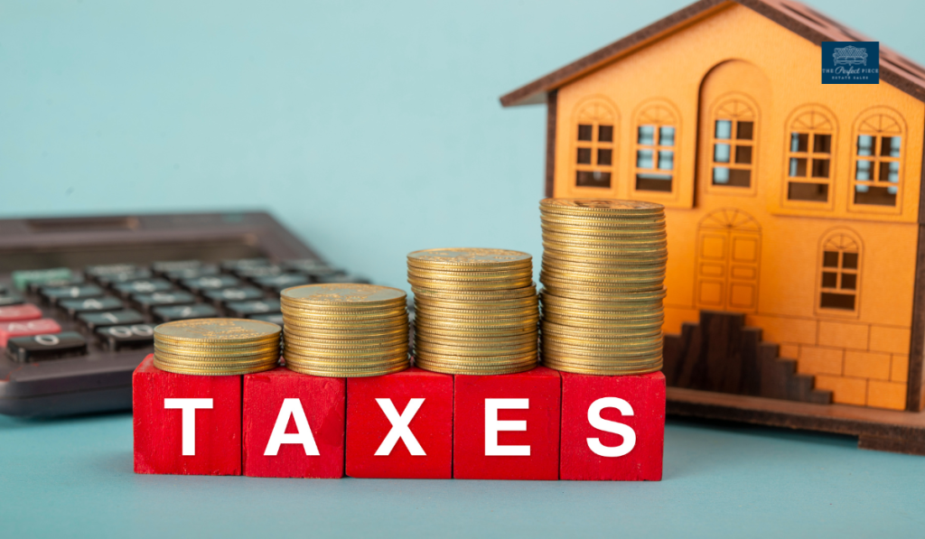 The word taxes is written on red blocks next to stacks of coins and a model house.