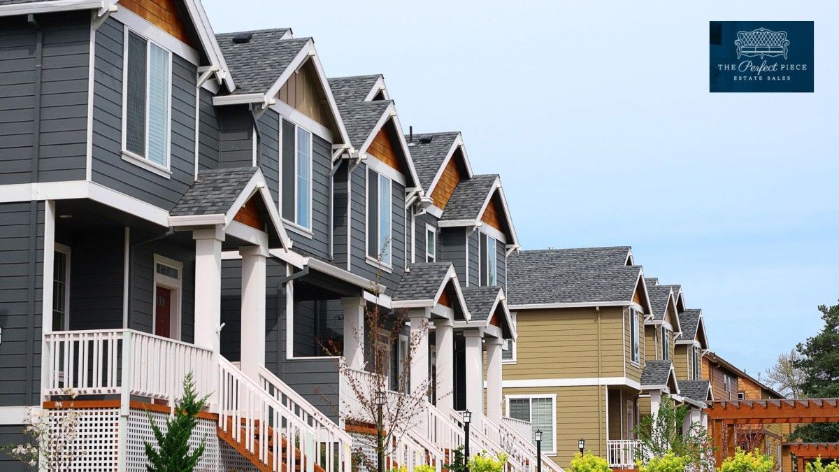 A row of houses with stairs leading up to them in a residential area.