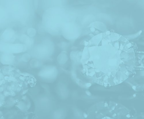 A close up of a diamond on a blue background.