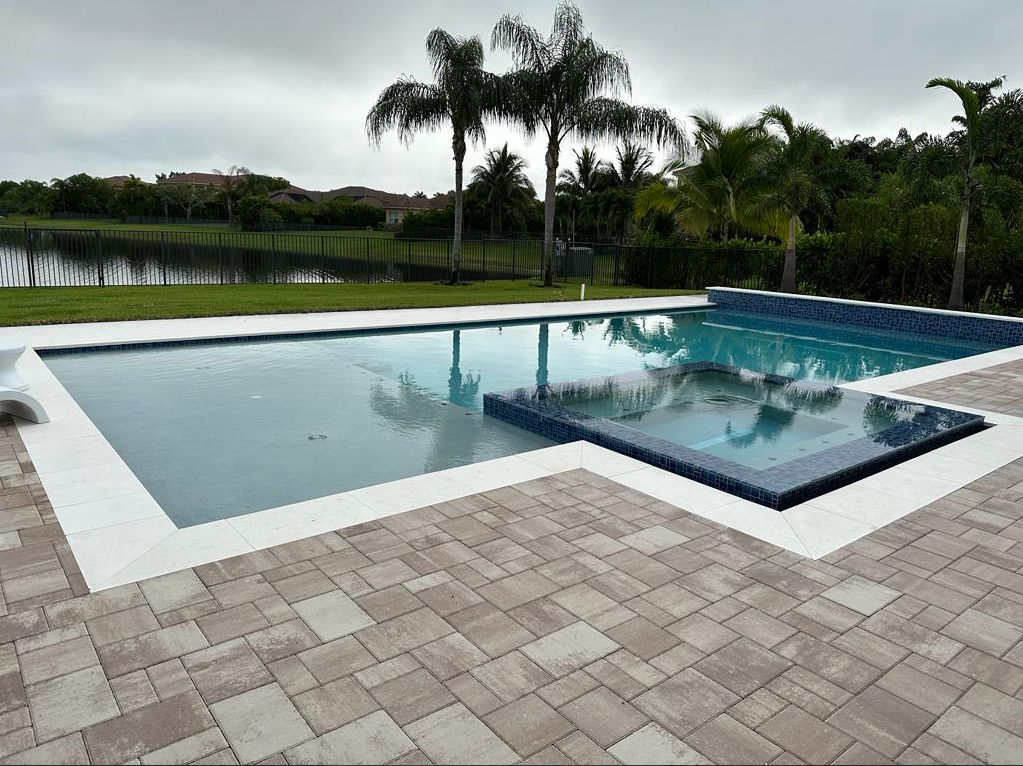 A large swimming pool with palm trees in the background
