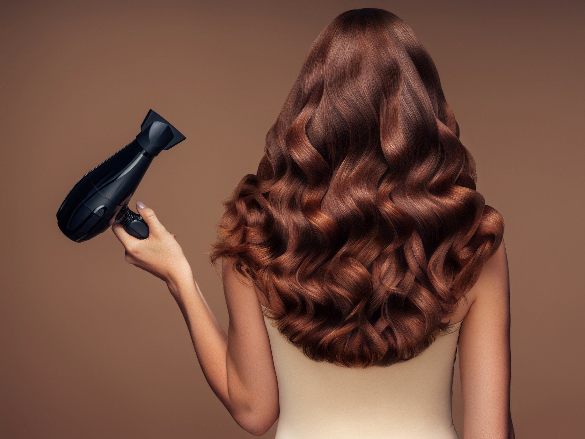 Woman with Brown Hair Holding a Hair Dryer — Marco Island, FL — Look Hair Nails