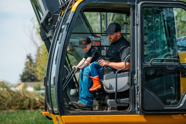 deere tractor on semi-truck trailer