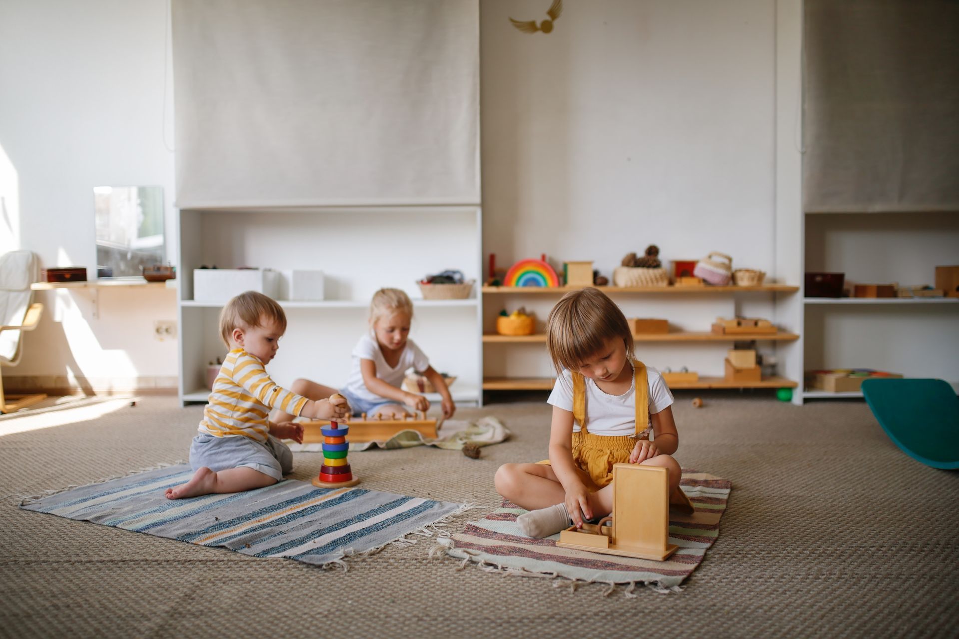Three children playing with toys.
