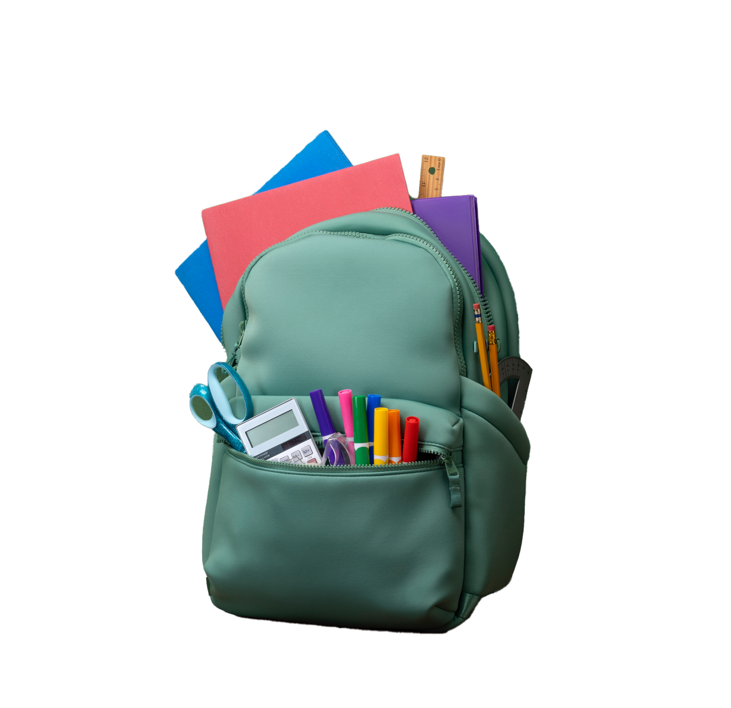 Green backpack filled with school supplies, including folders, pens, and scissors.
