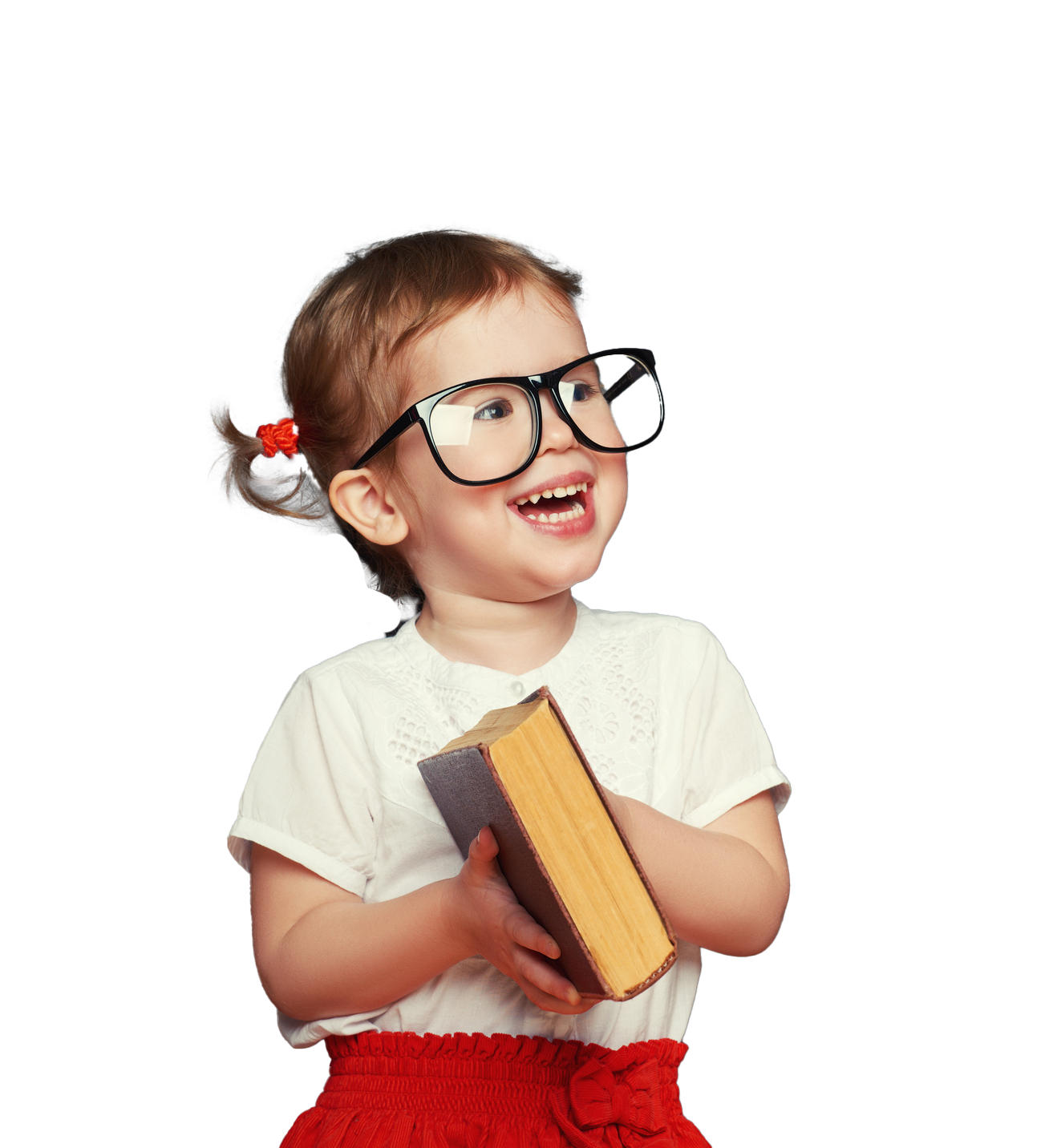Smiling toddler wearing glasses and holding a book, looking upwards.