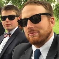 andrew in sunglass and suit