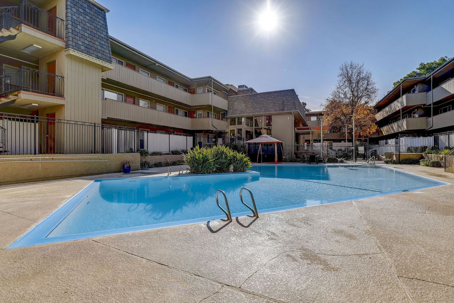 A large swimming pool in front of a building