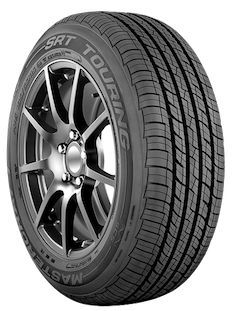 A close up of a tire on a wheel on a white background.