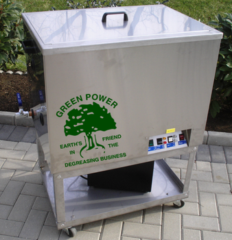 White metal bin labeled “Green Power” with a tree logo, sitting on a wheeled base outdoors.