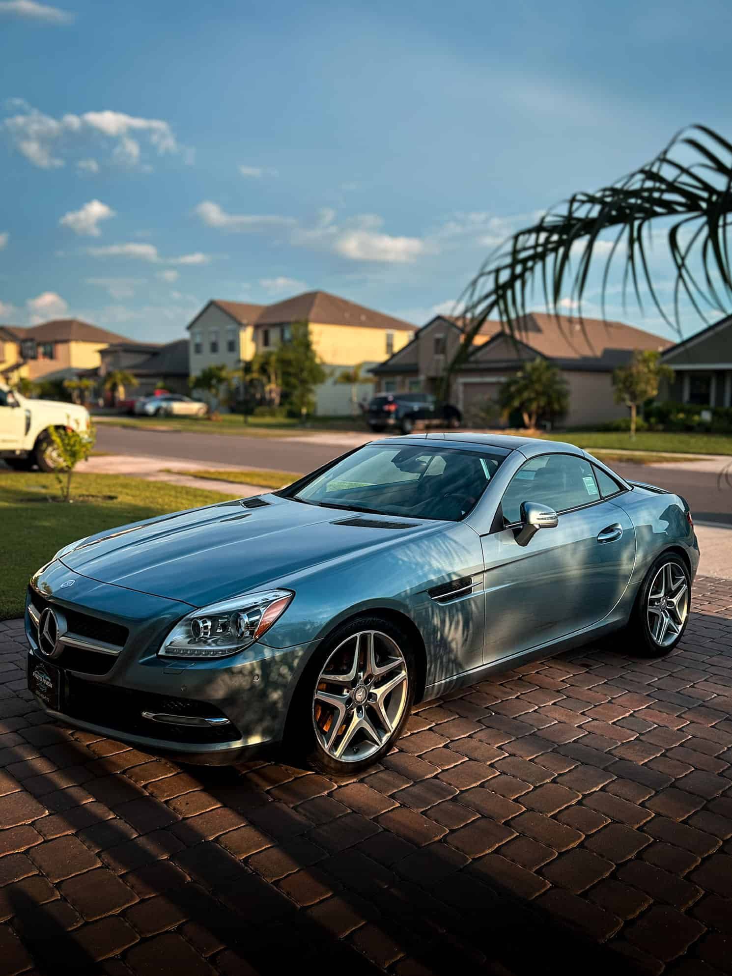 a clean Grey Mercedes SLK350 in an HOA after receiving a decontamination wash, clay bar treatment, & 1-year ceramic coating