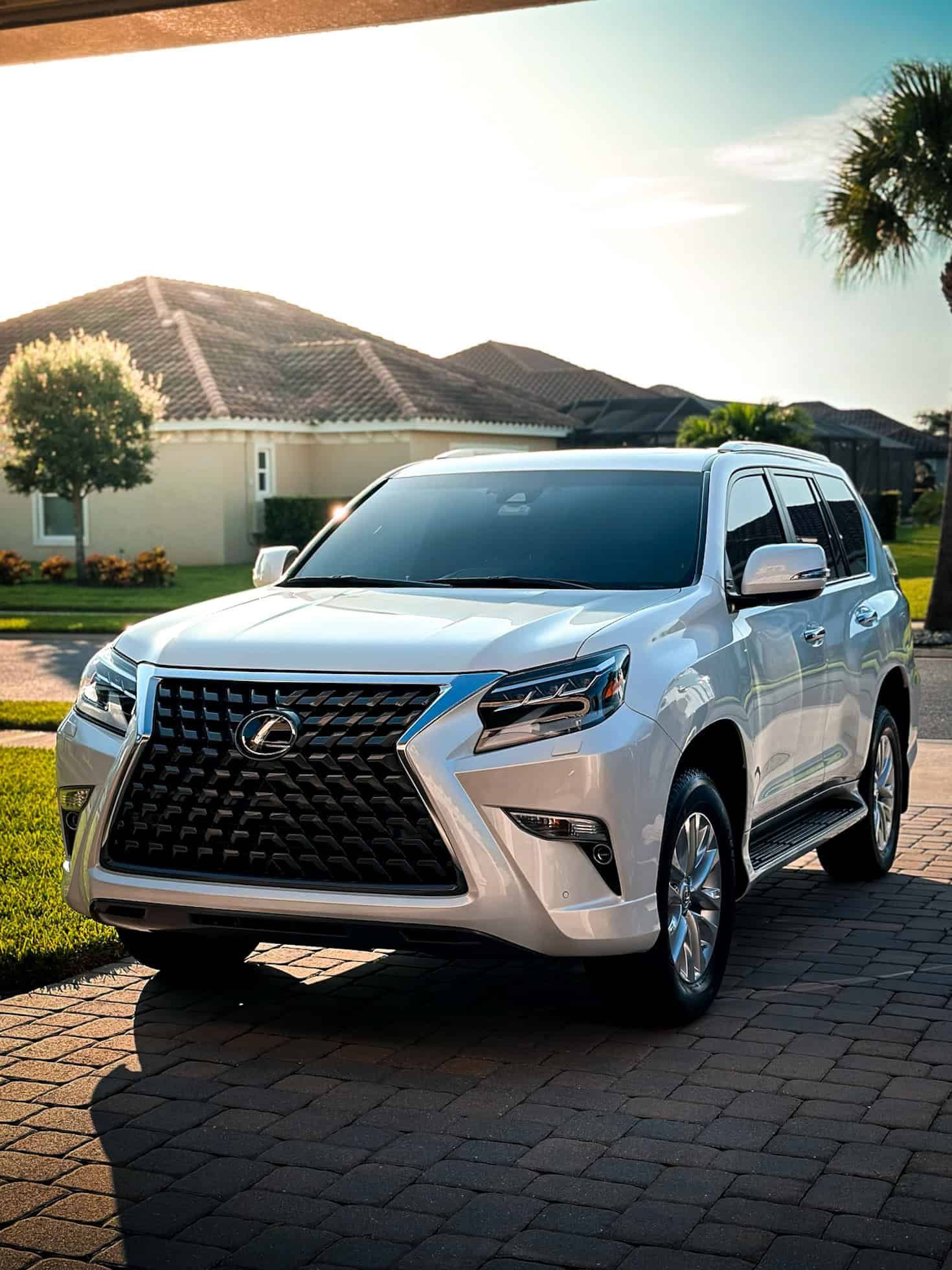 White 2023 Lexus GX 460 during golden hour with the sunset behind it after a decontamination wash and 1-year ceramic coating