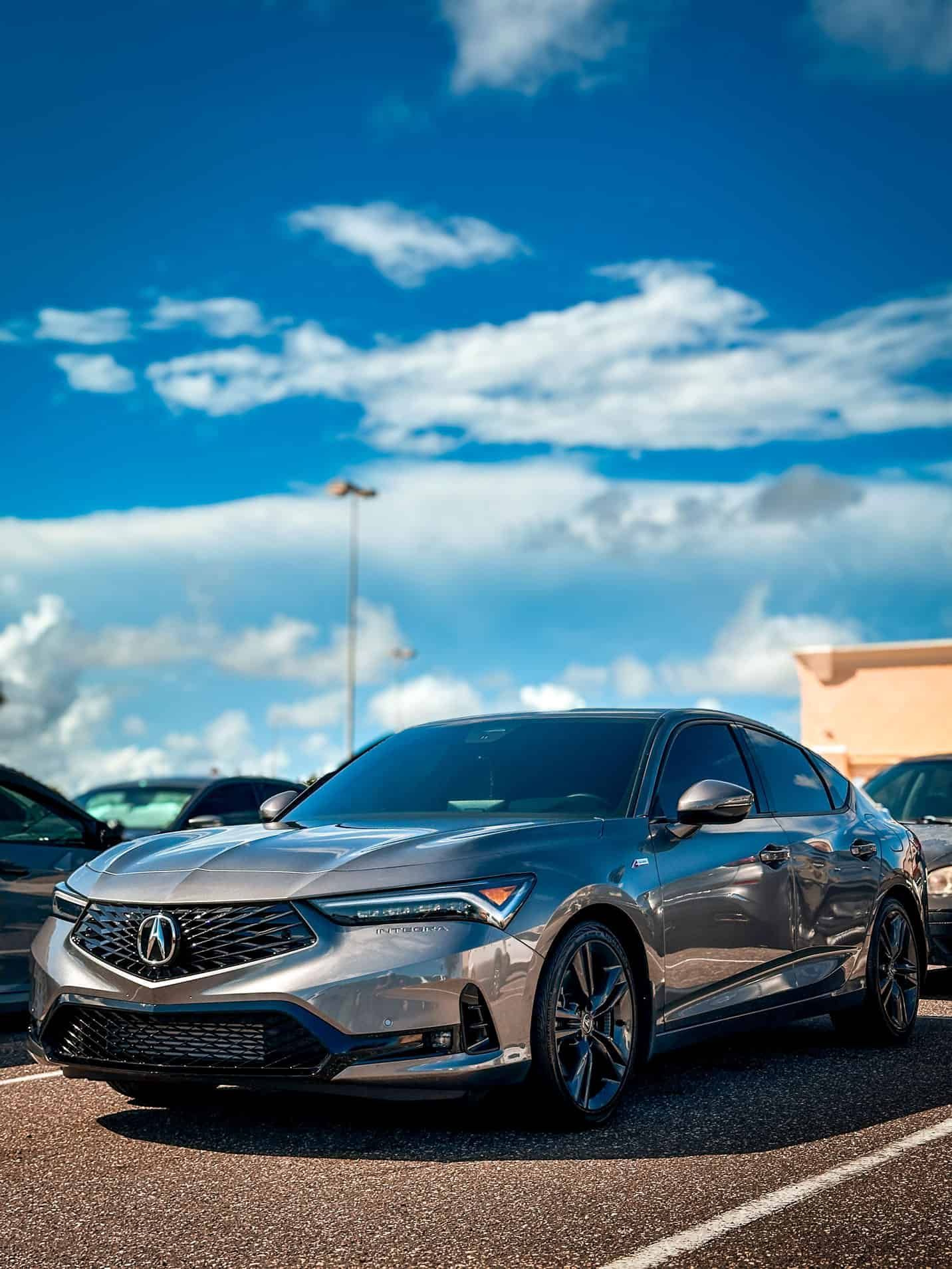 a lowered 2024 Grey Acura Integra after receiving a full detail parking lot in Palm Bay, FL