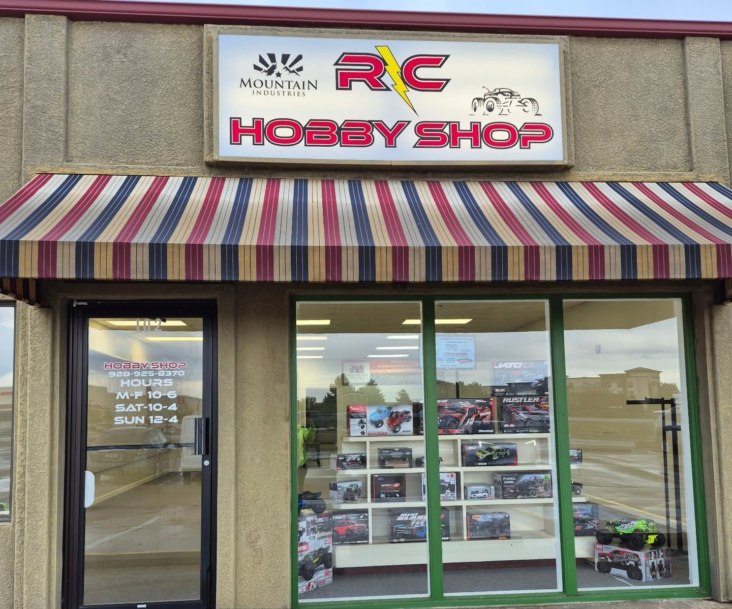 RC Hobby Shop storefront with awning, sign, and display window.