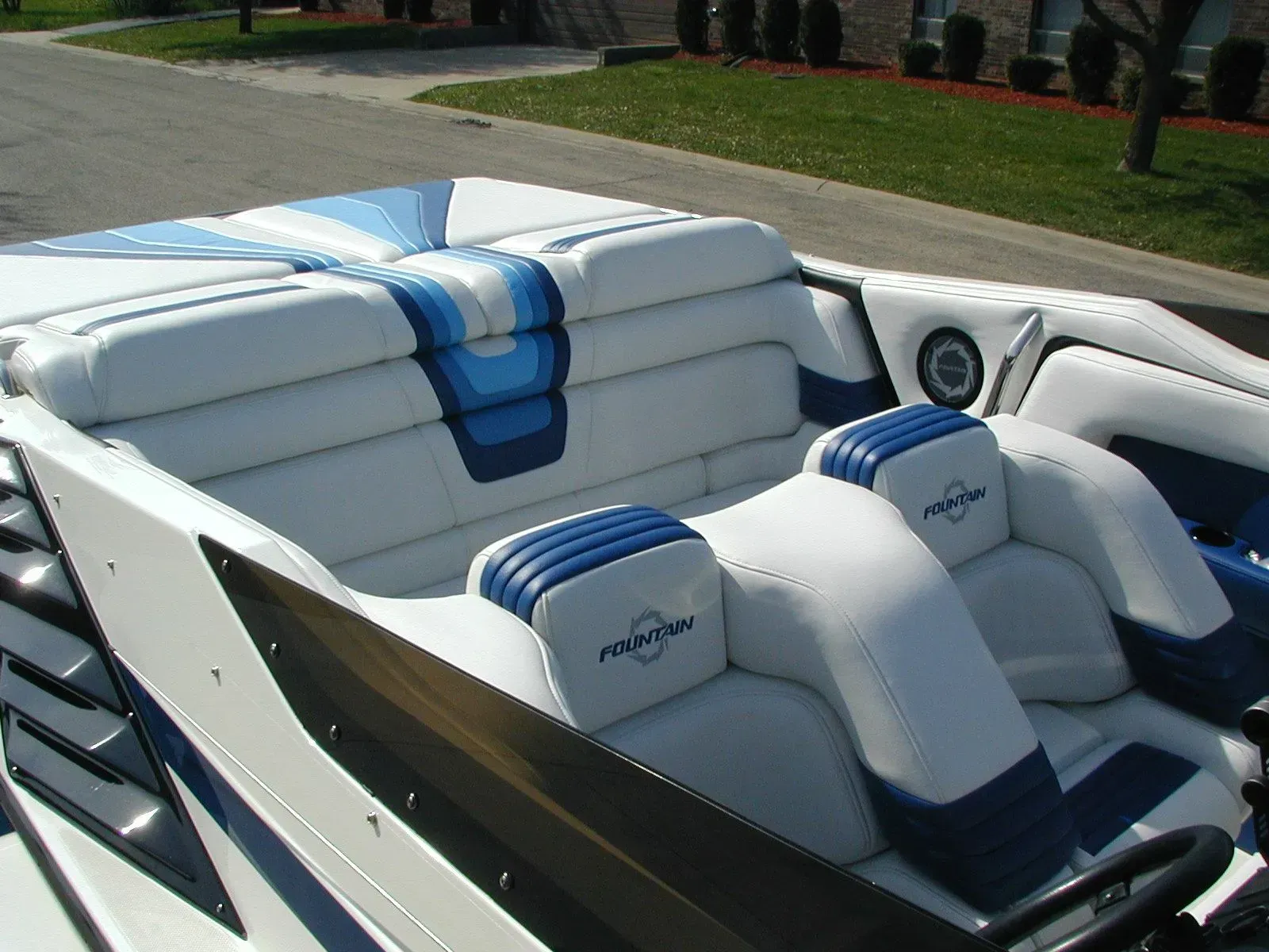 A boat with blue and white seats and the word ranger on the back