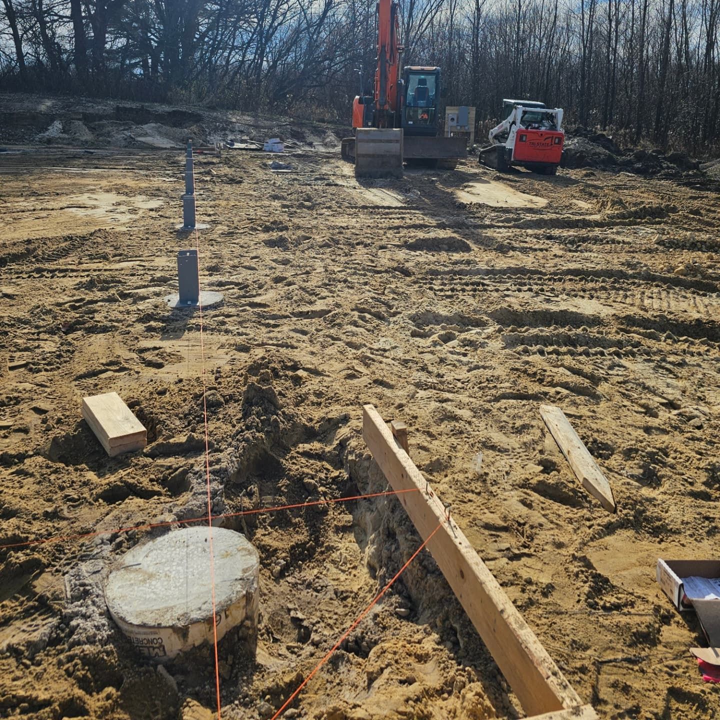A construction site with a bulldozer in the background