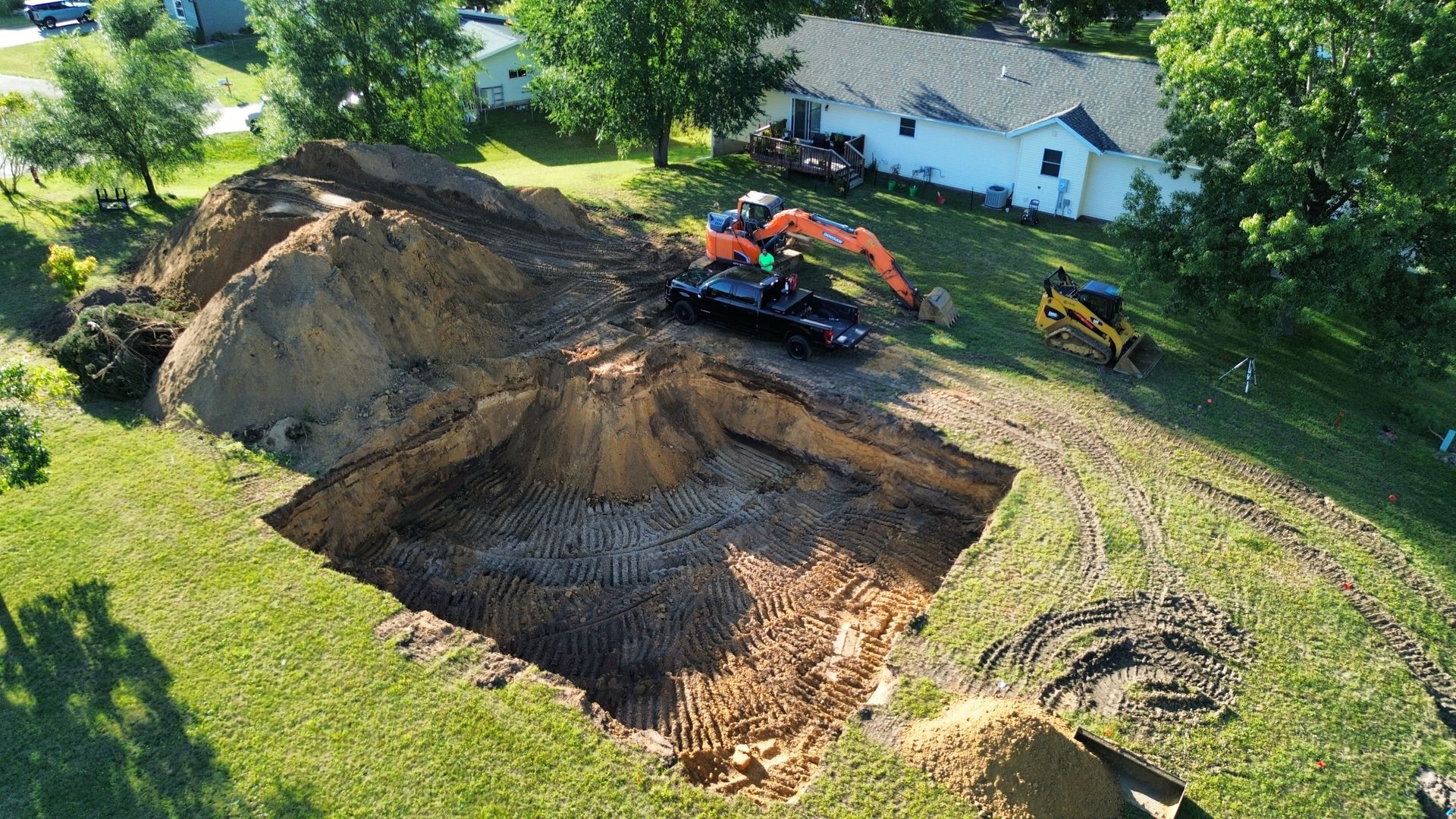 An aerial view of a construction site with a large hole in the ground.