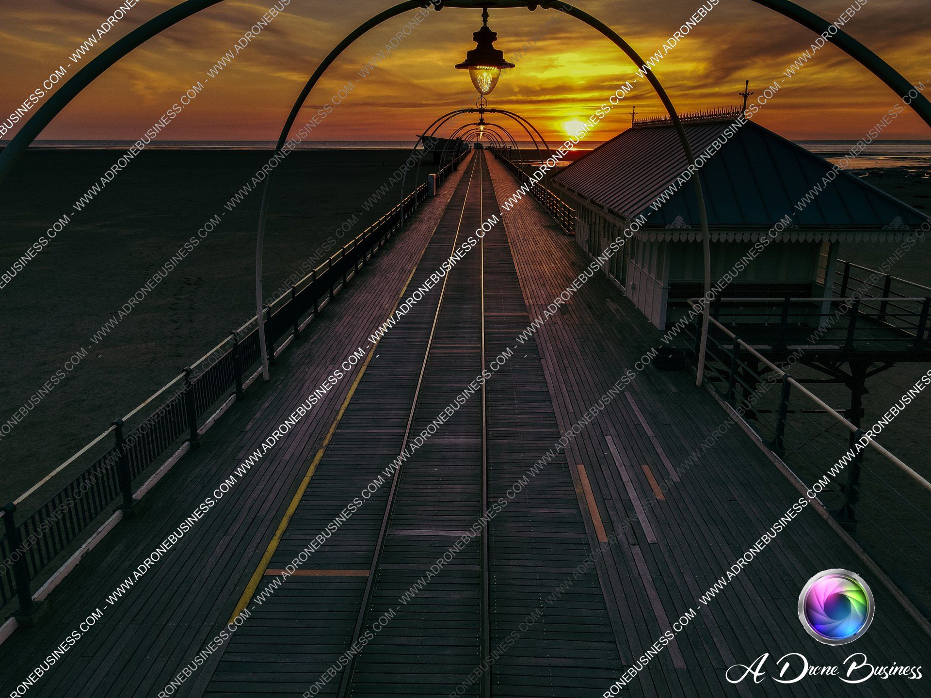 Sunset setting over Southport Pier, Lancashire, United Kingdom