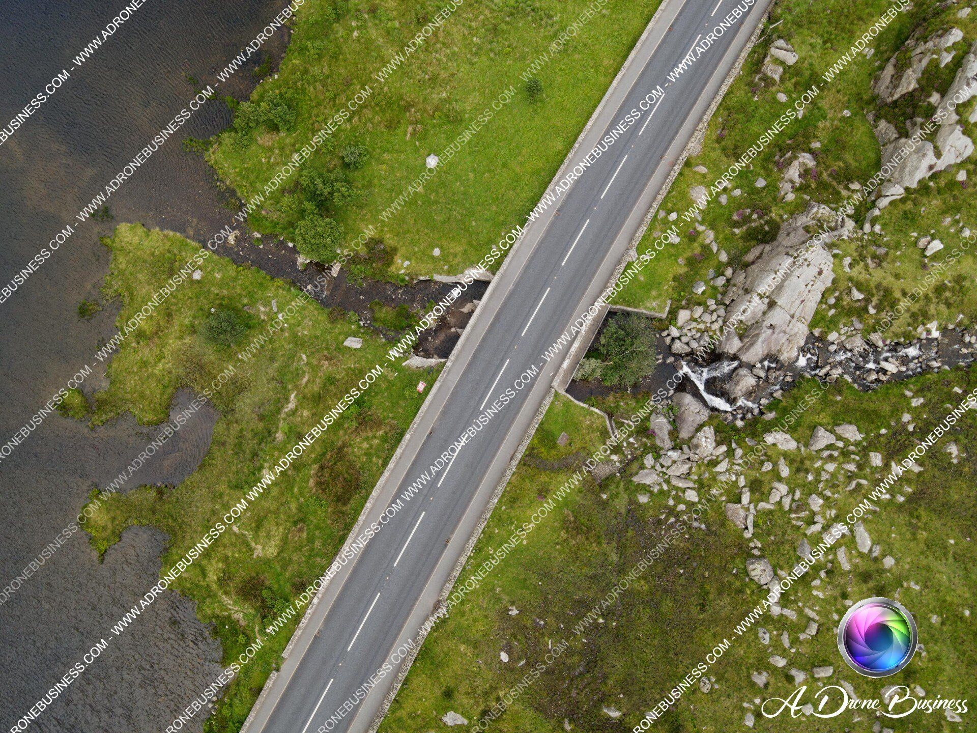 The A5 road flowing through North Wales as it ventures from Bethesda to Betws-y-Coed, crossing a small bridge as it passes Llyn Ogwen