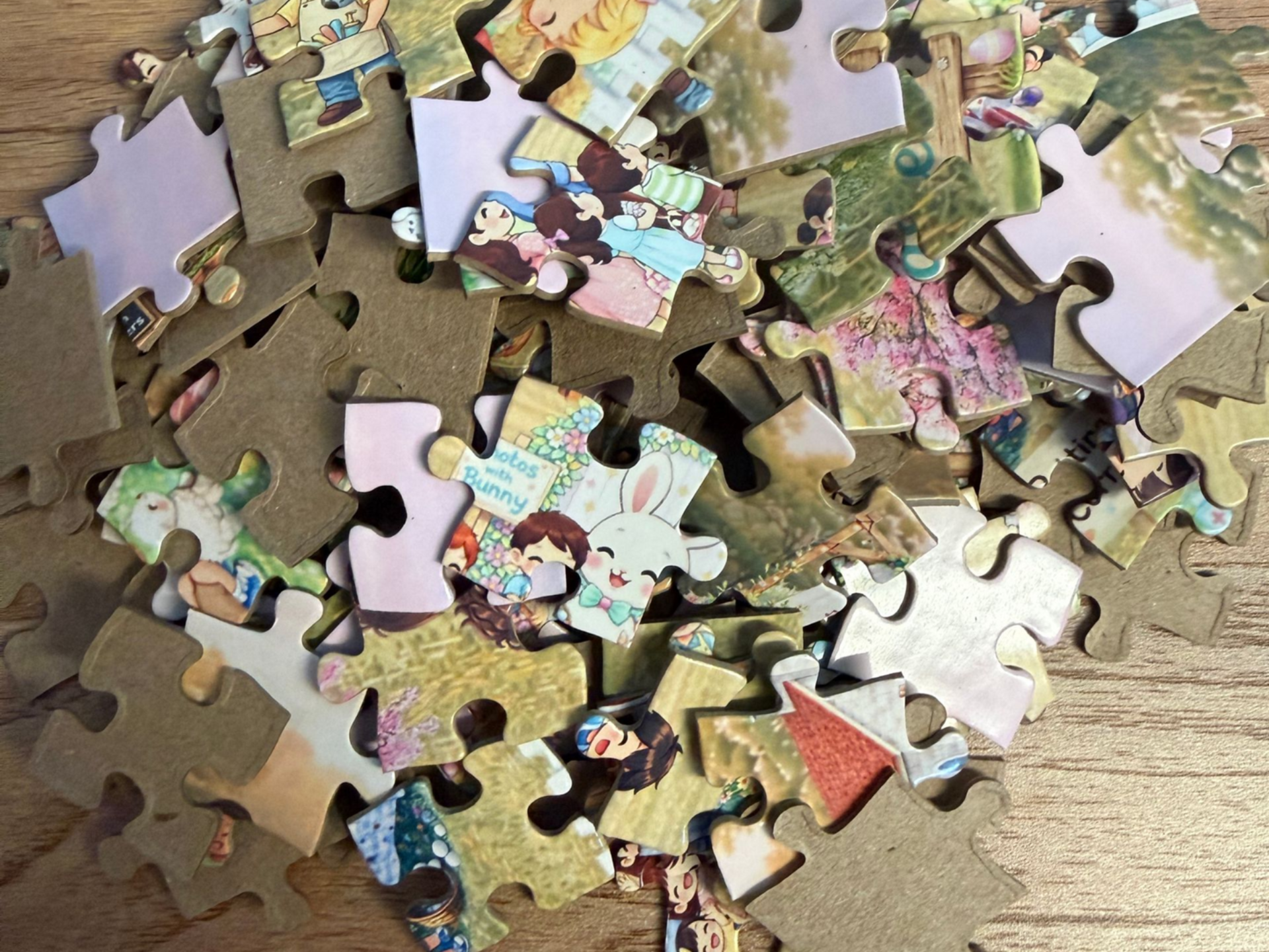Easter jigsaw puzzle pieces scattered on table, thick durable cardboard with detailed family-friendly design