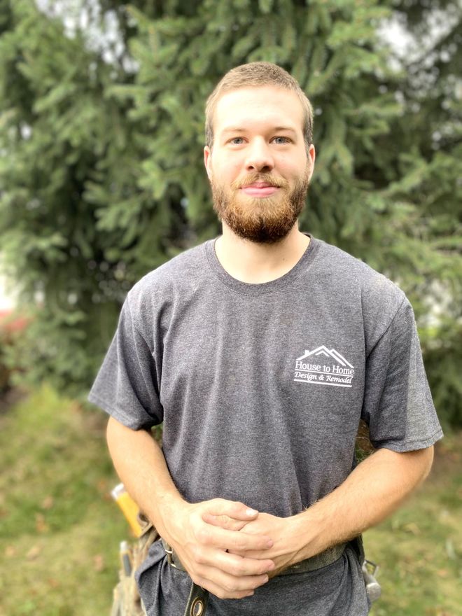 a man with a beard wears a house to home t-shirt