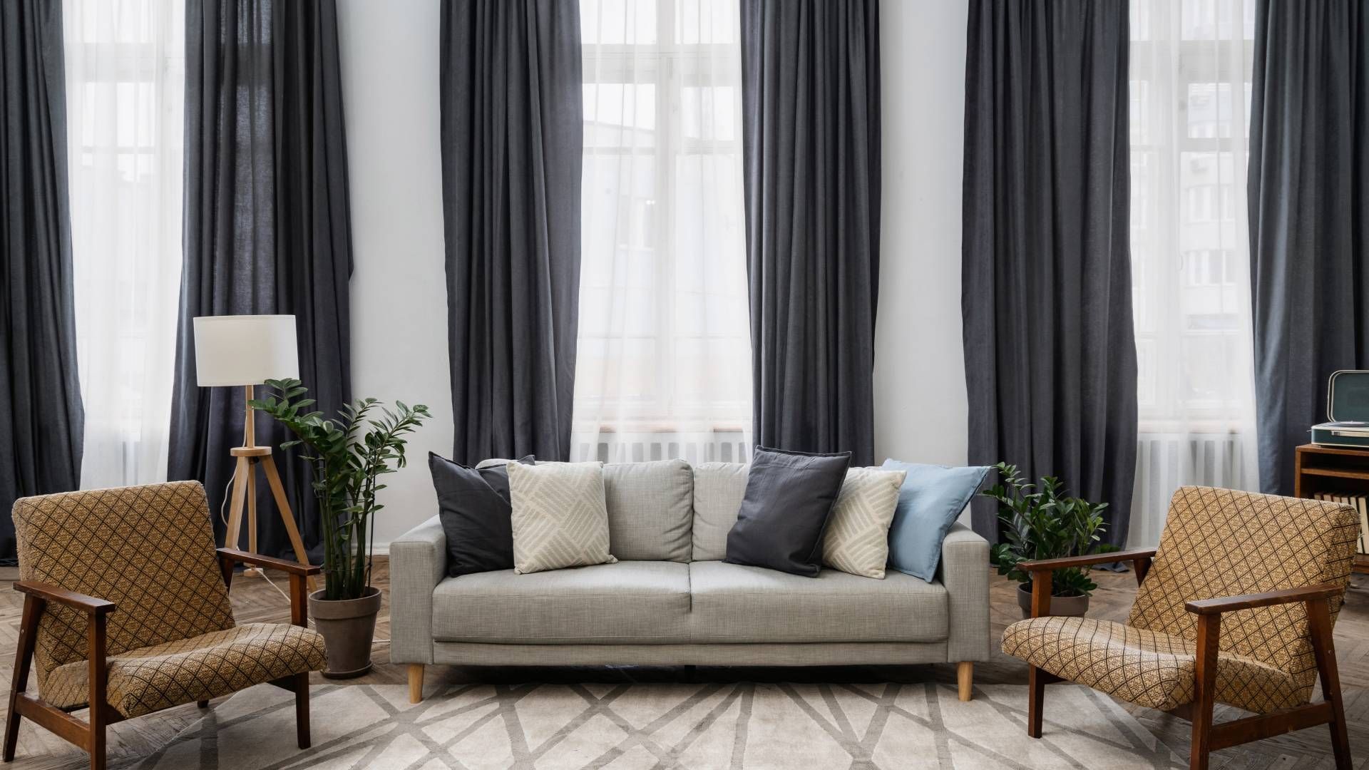 A well-coordinated living room with cohesive interior paint and window treatments with complementing