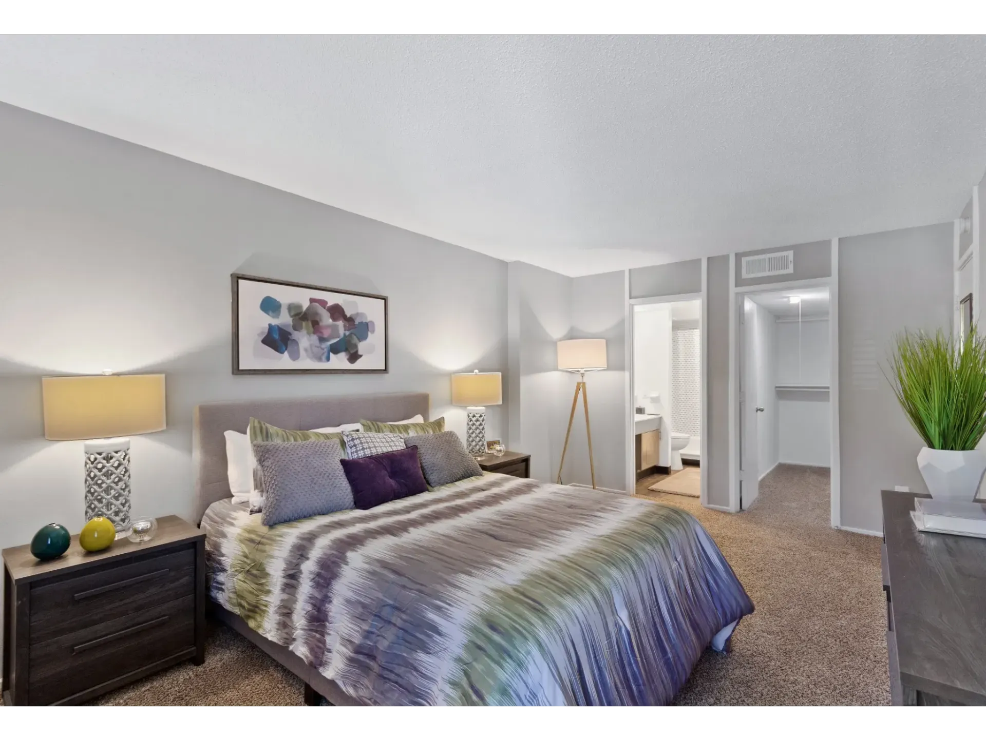 Cozy bedroom with a bed, bedside tables, and decorative items