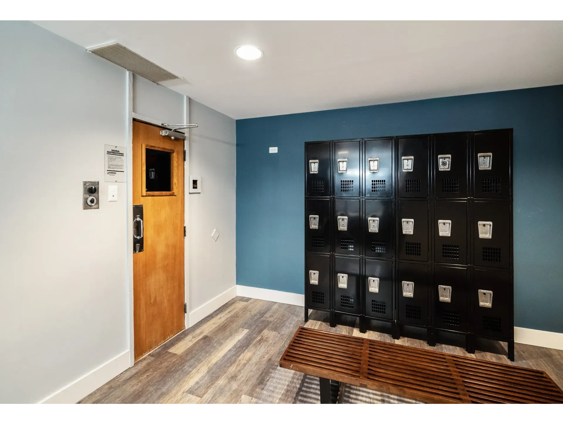 Interior space with lockers and a wooden bench