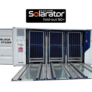 Solararator fold-out solar panels in a shipping container. Panels are deployed, with Black Stump logo visible.