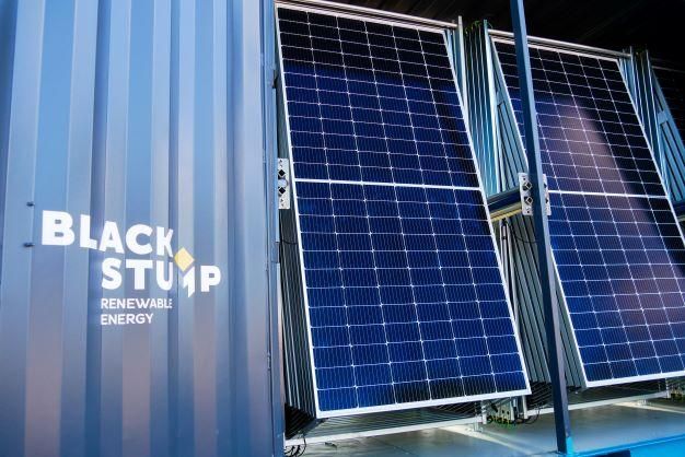 Solar panels mounted on a container, labeled