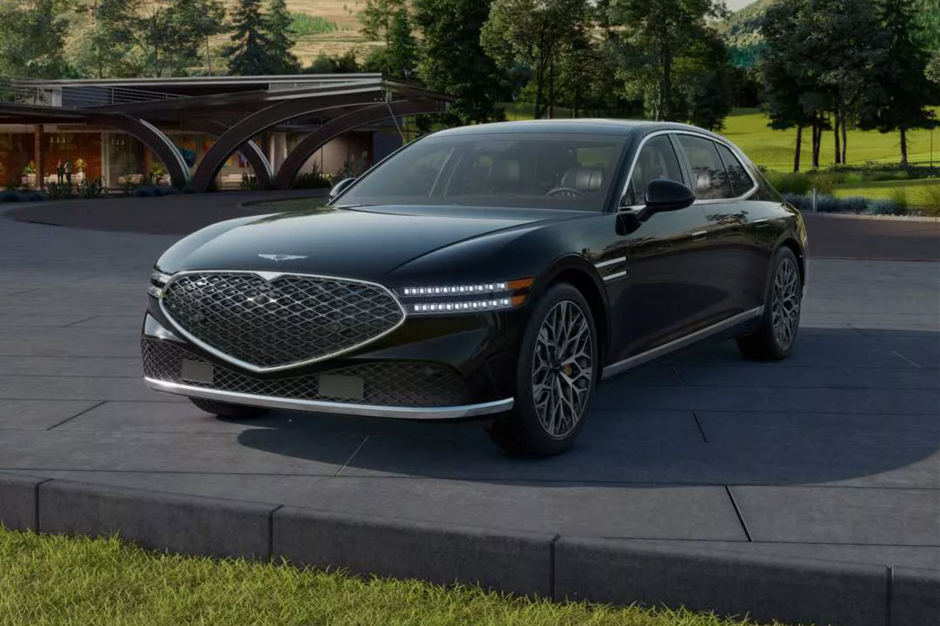 Dark gray Genesis sedan with a large grill and unique wheels.