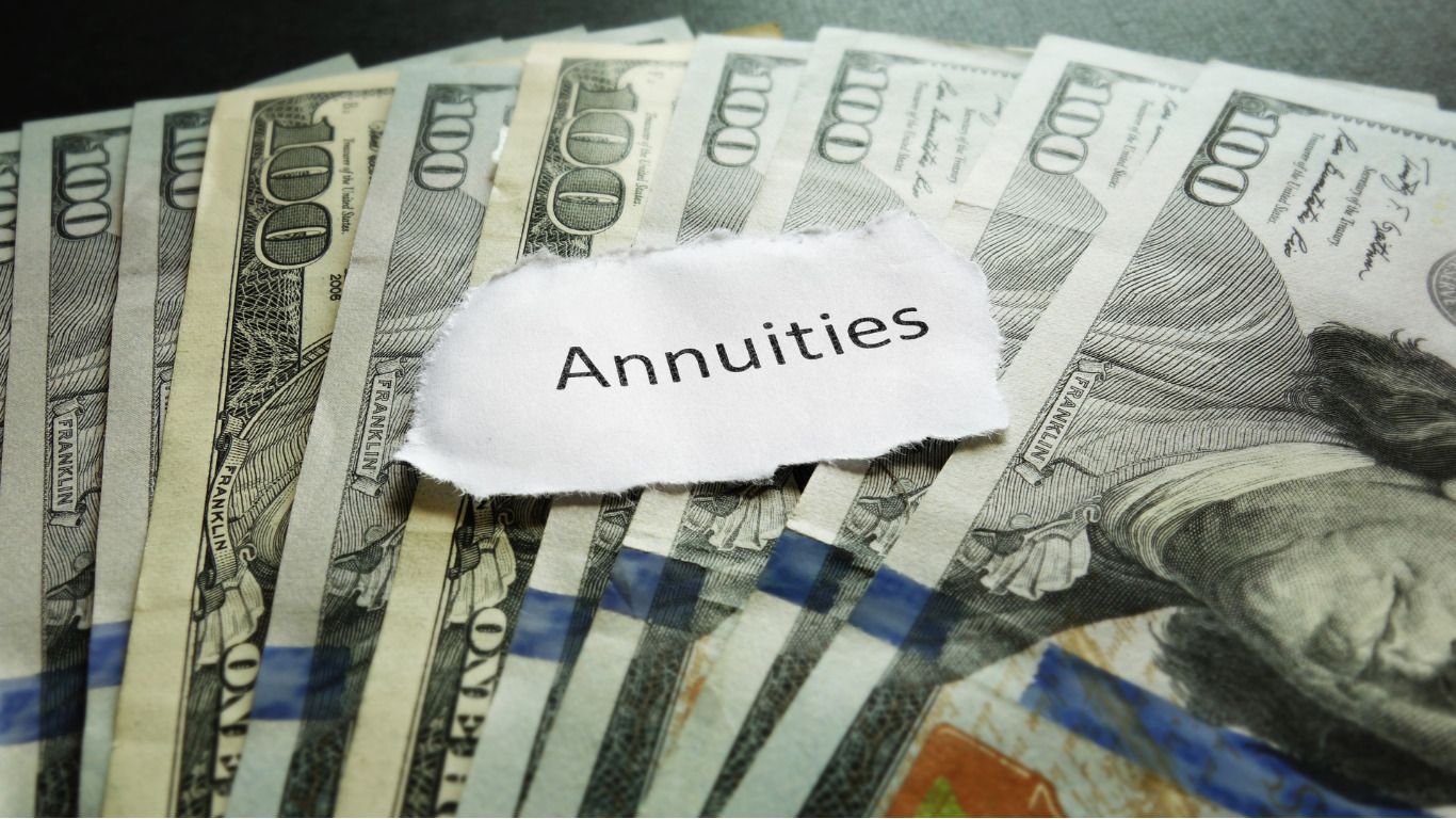 A pile of money with a piece of paper that says annuities