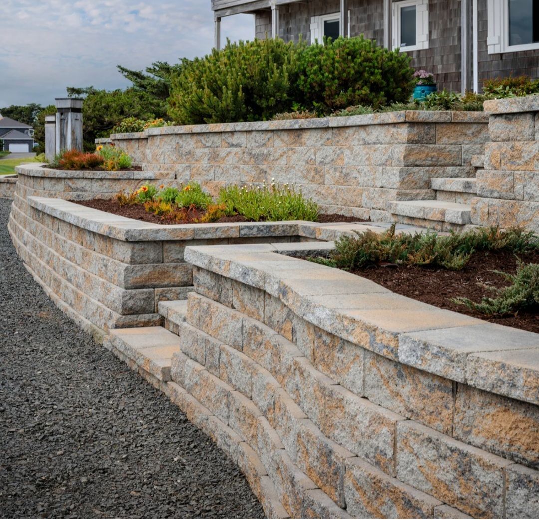 A brick wall with steps leading up to a house