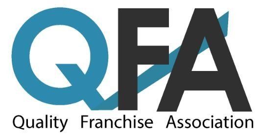 The logo for the quality franchise association