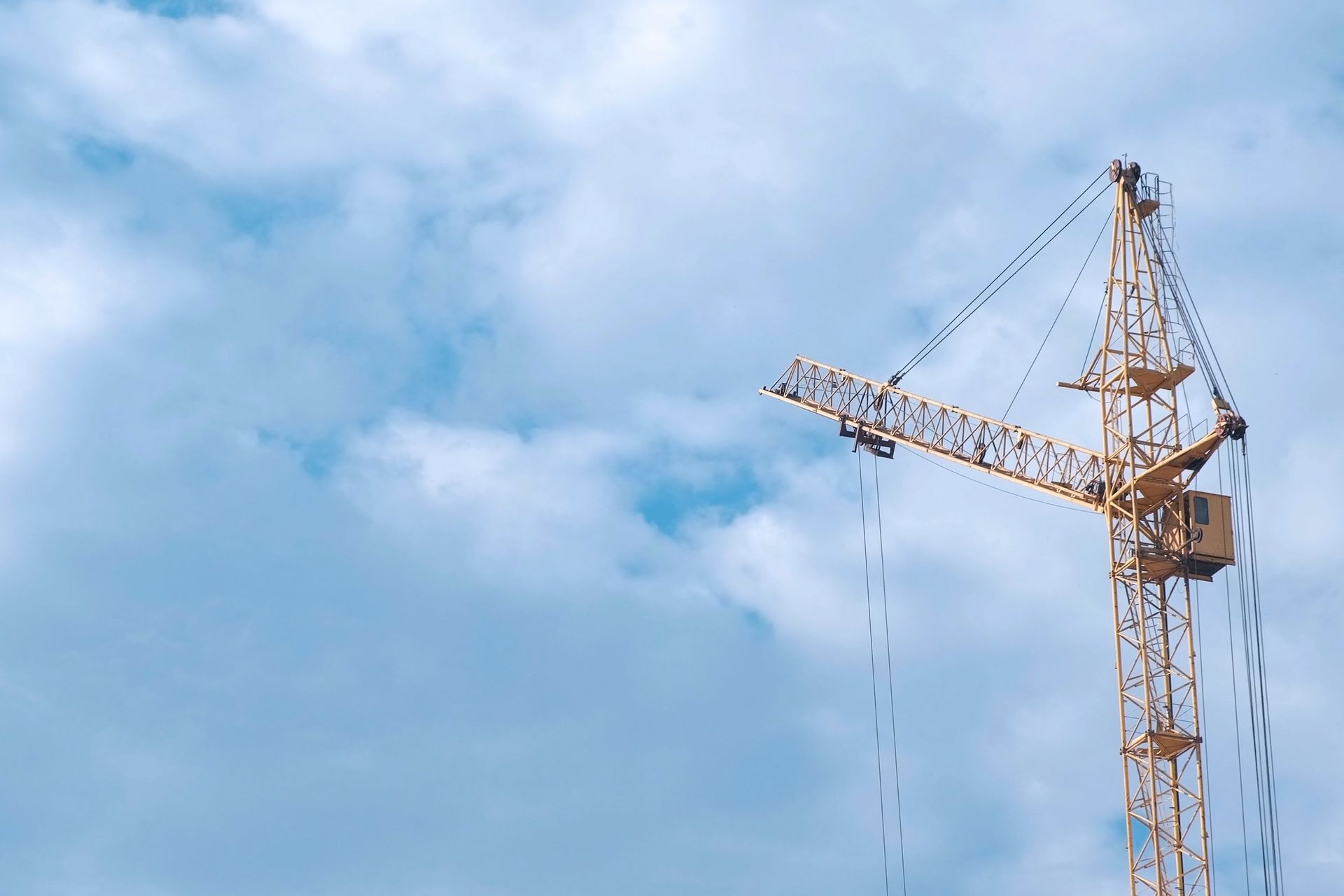 Construction crane on sky background in outdoor. Construction crane on sky background in outdoor.