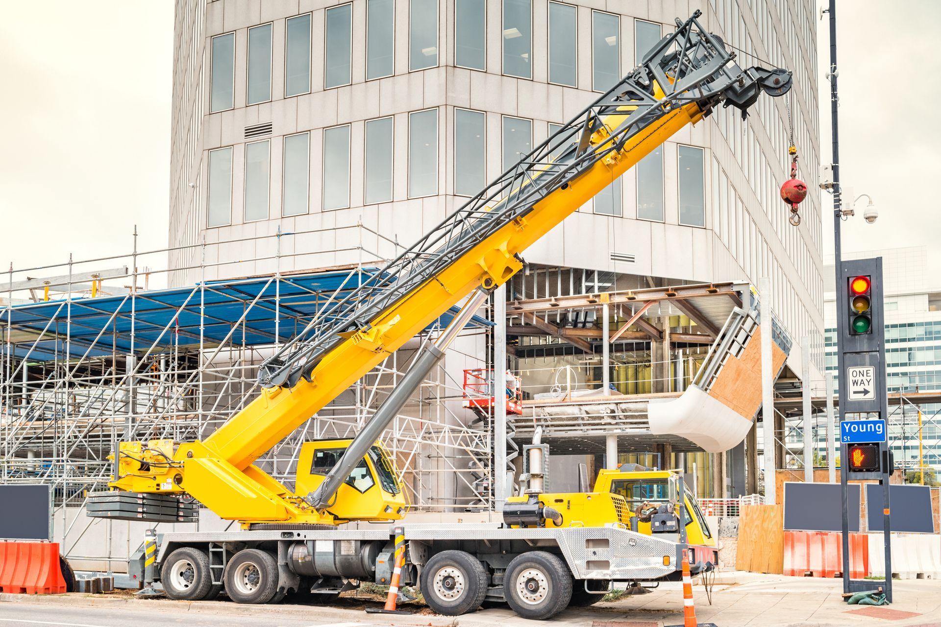 A mobile crane set up on-site for construction work.