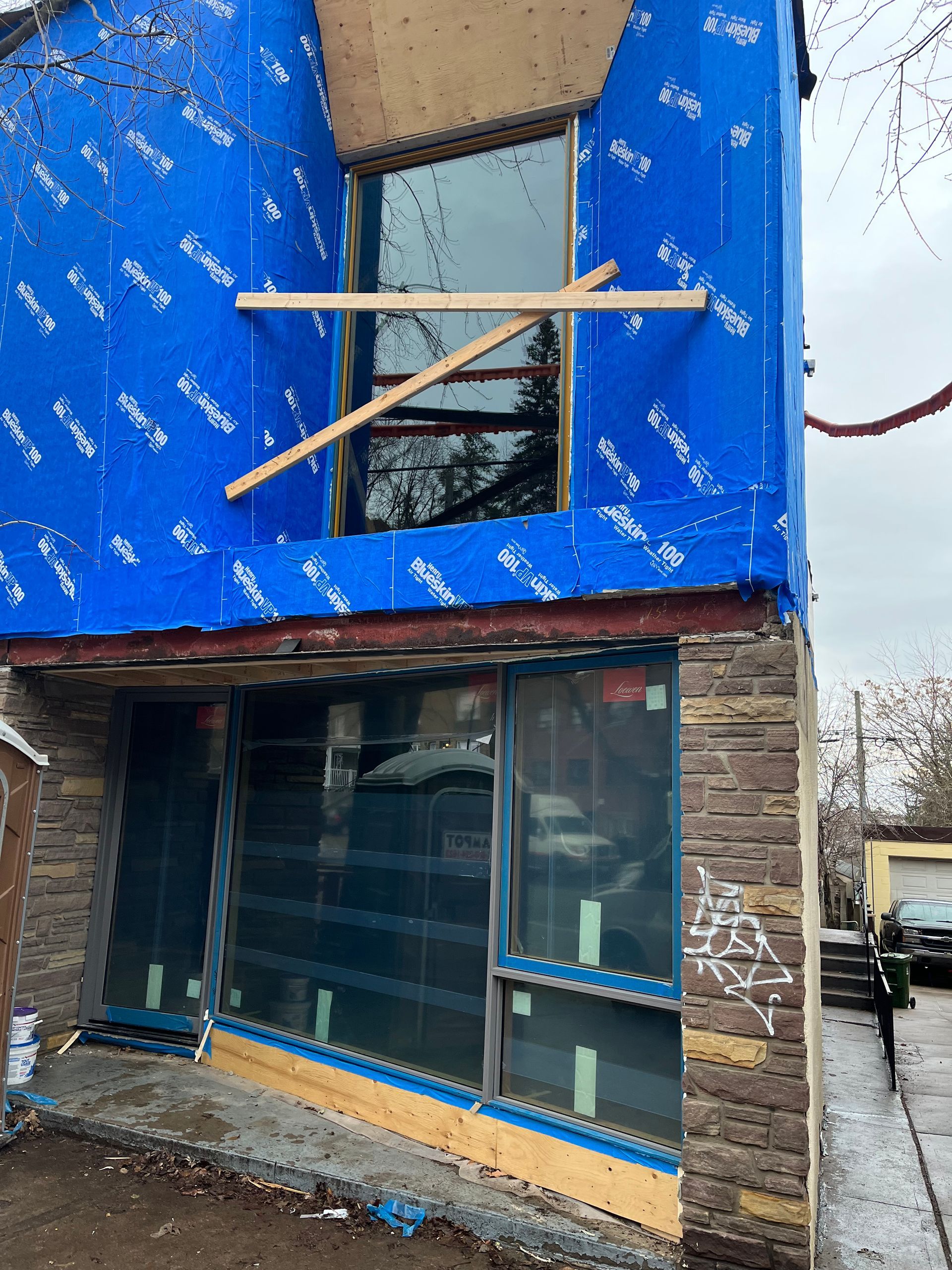 A building with a lot of windows is being remodeled