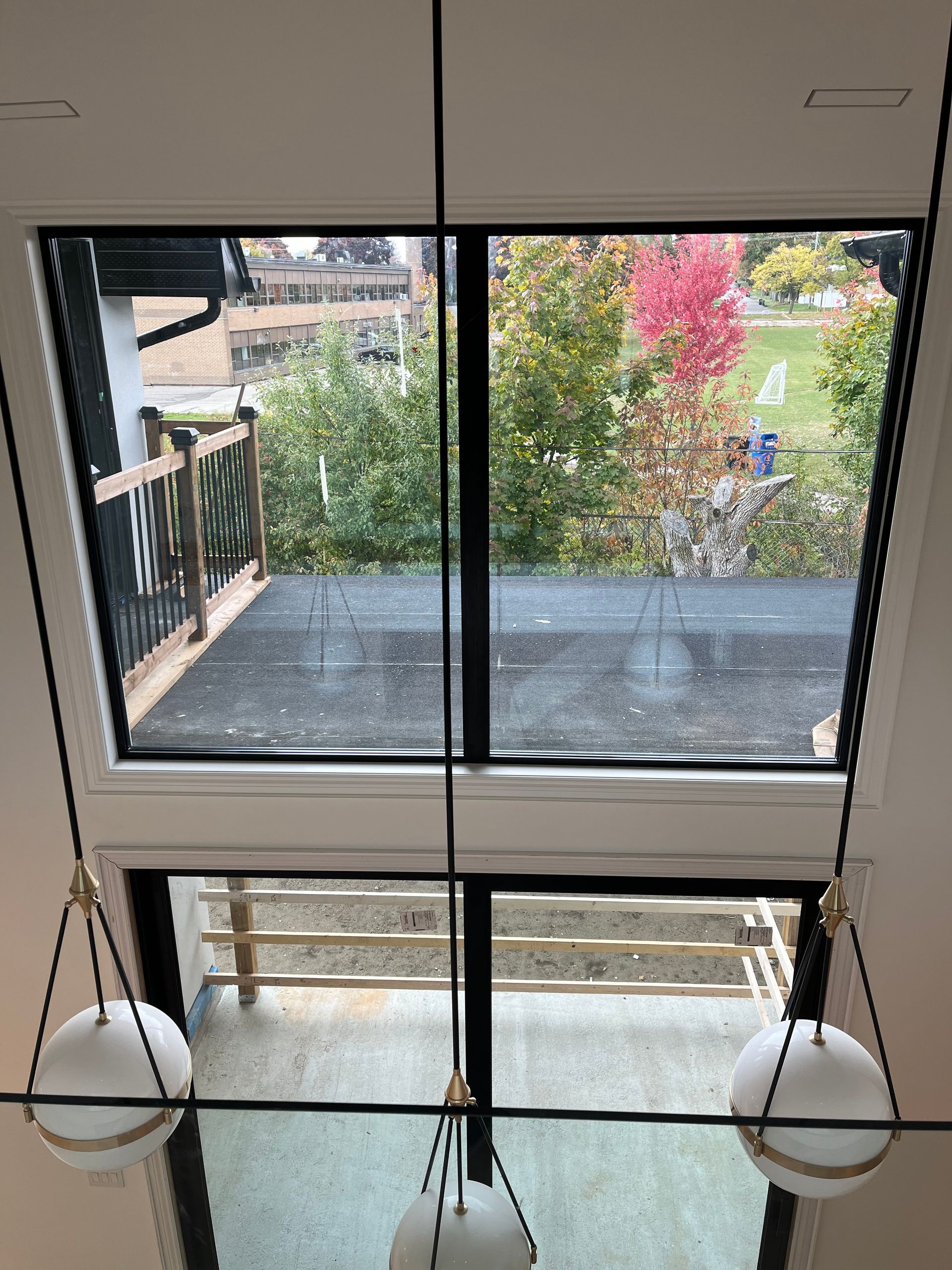 A view of a balcony from the second floor of a house.