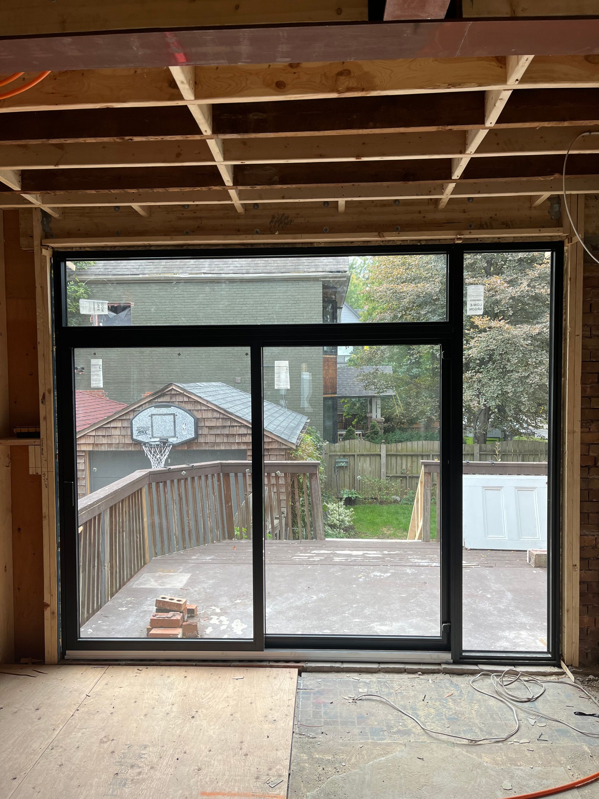 A room with a sliding glass door leading to a deck