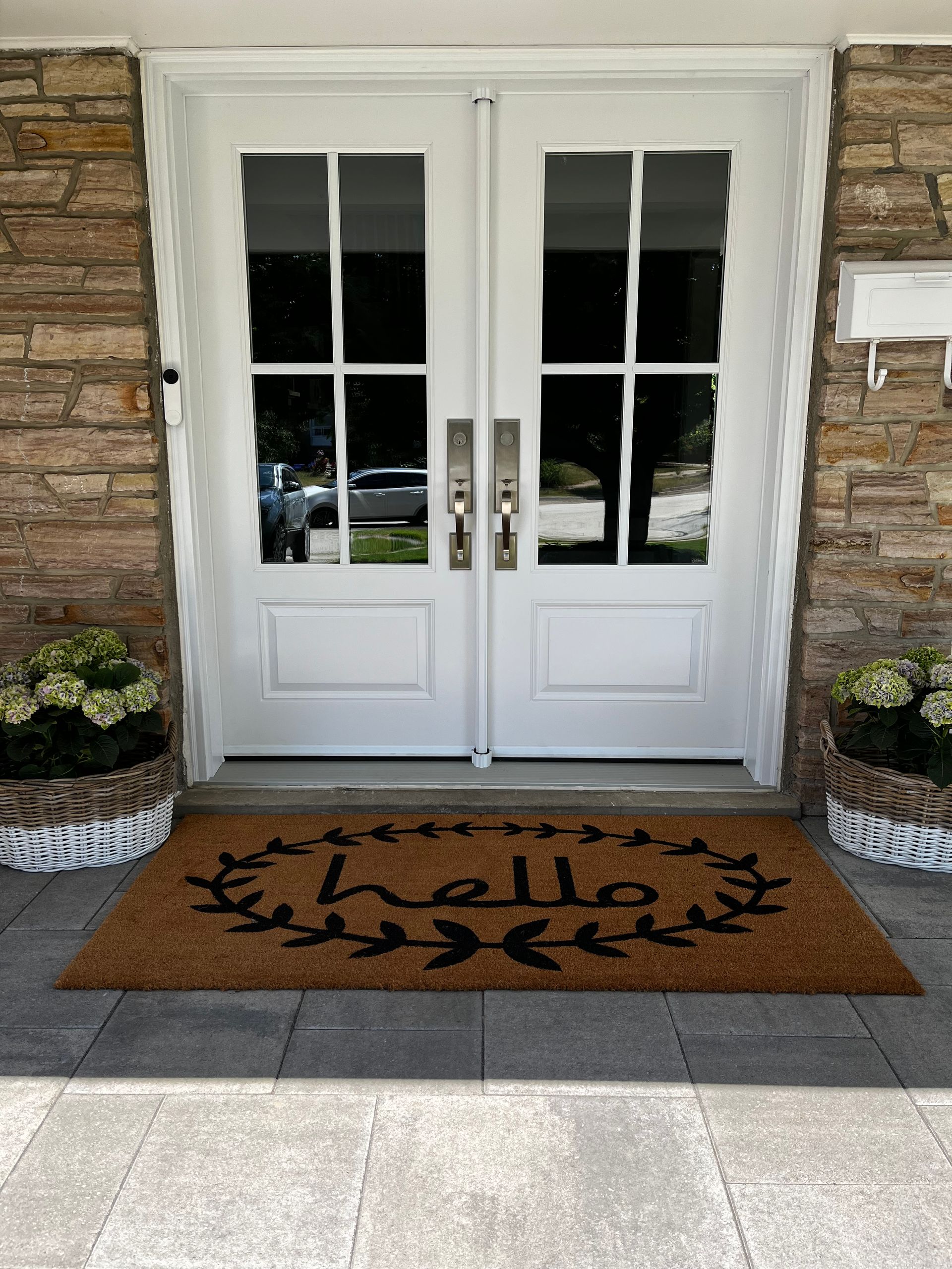 A door with a welcome mat in front of it