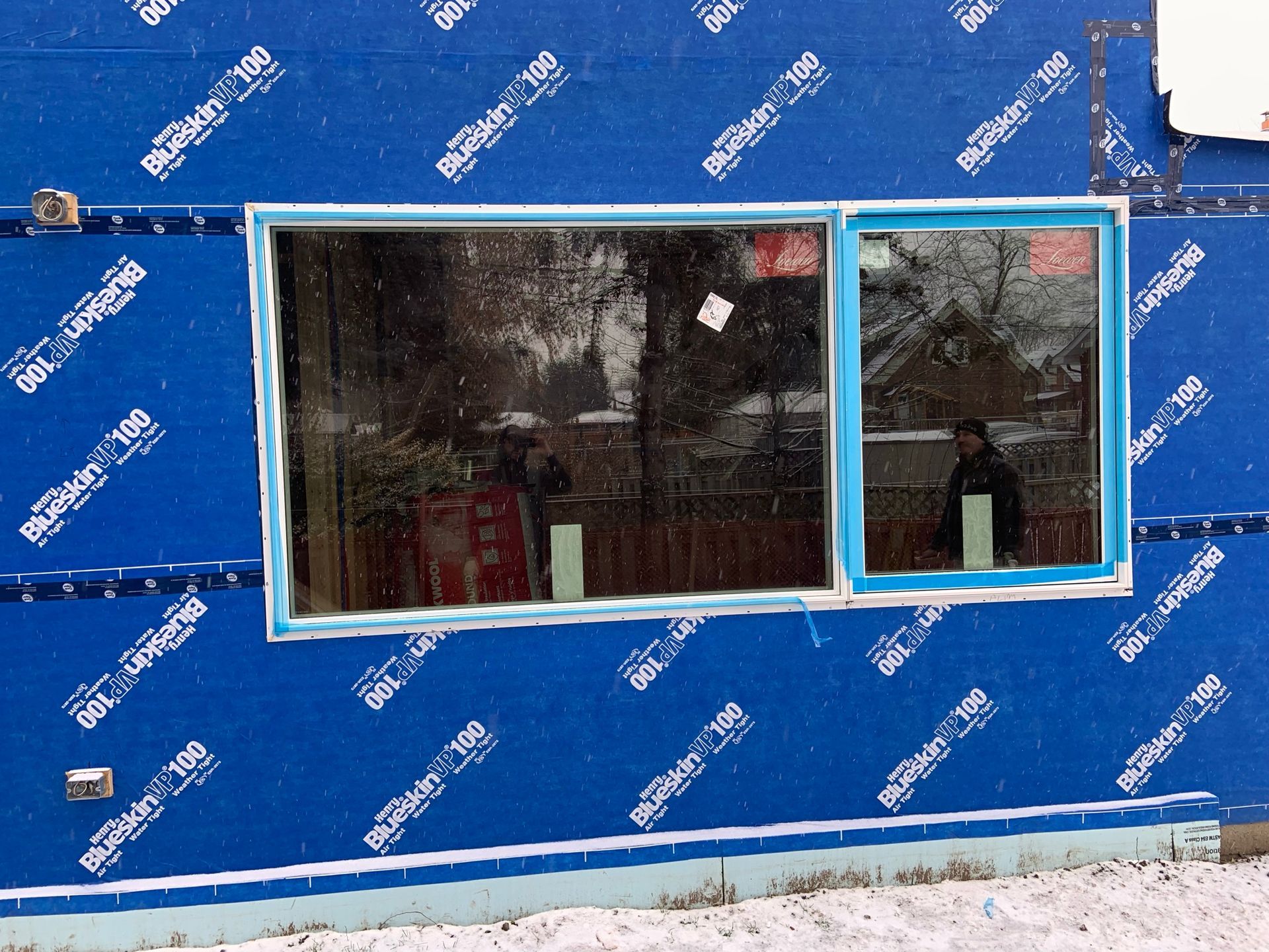 A blue wall with a window on it