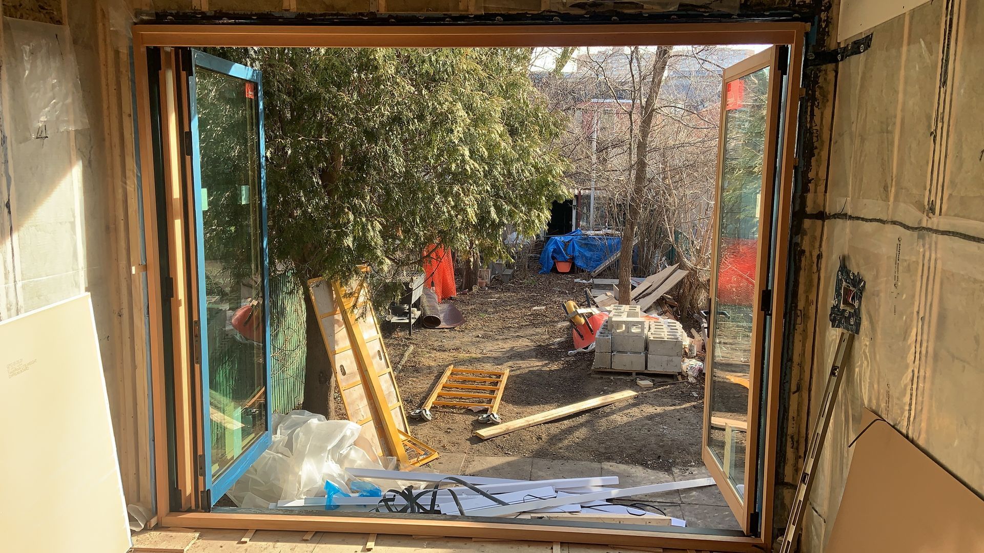 A window in a room with a view of a construction site.